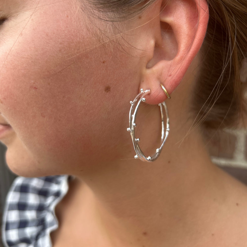 
                      
                        Twisted Hoop Earring
                      
                    