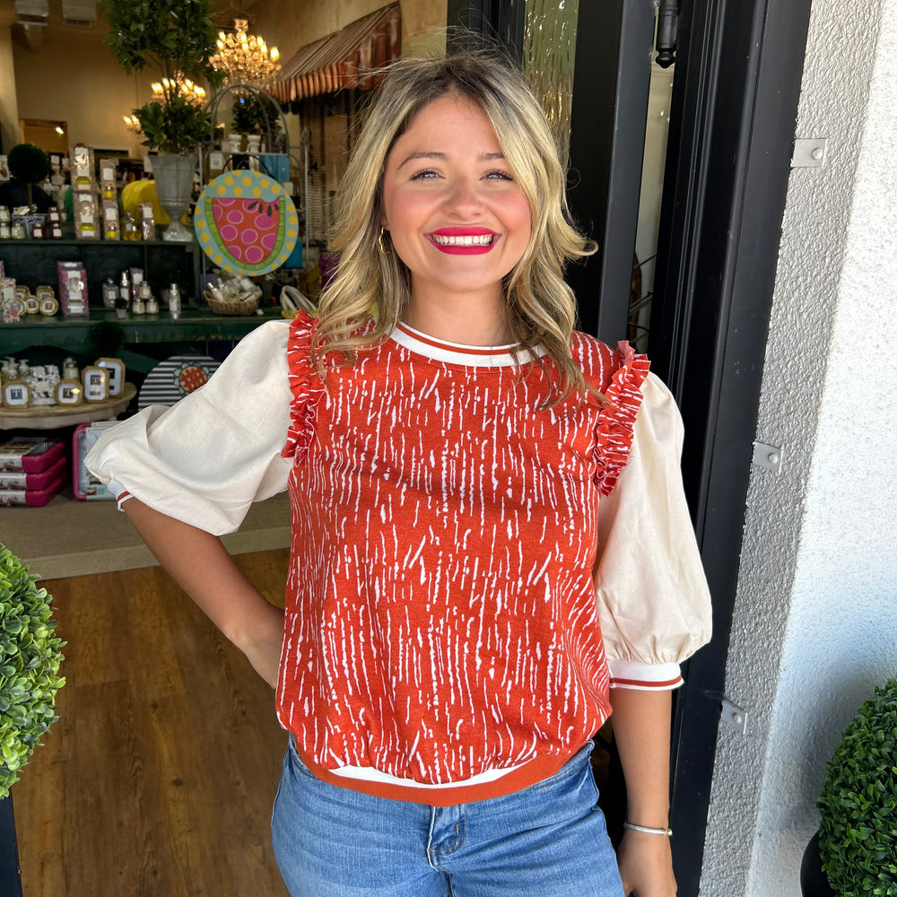 
                      
                        Tatum Orange Ruffled Blouse
                      
                    